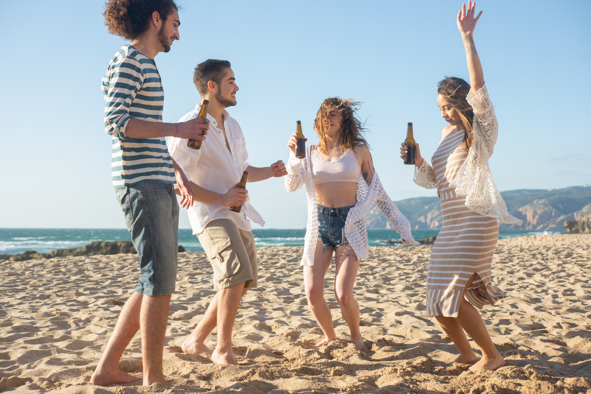 People Dancing on the Beach